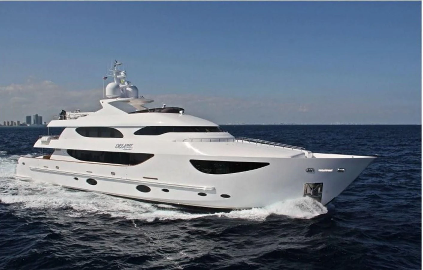 a white yacht on the water aboard TRUE NORTH Yacht for Sale