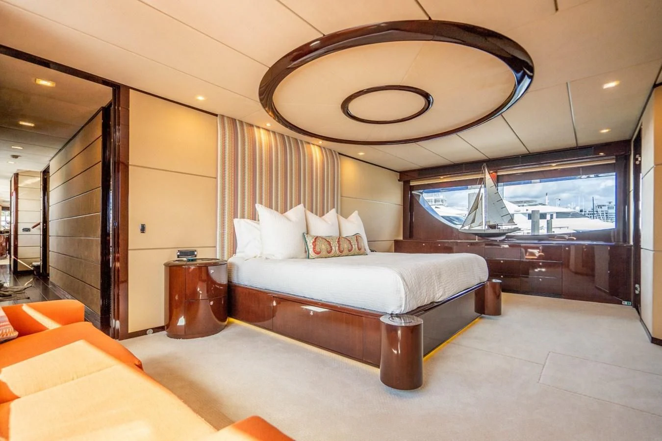 a large room with a bed and a large mirror aboard TRUE NORTH Yacht for Sale