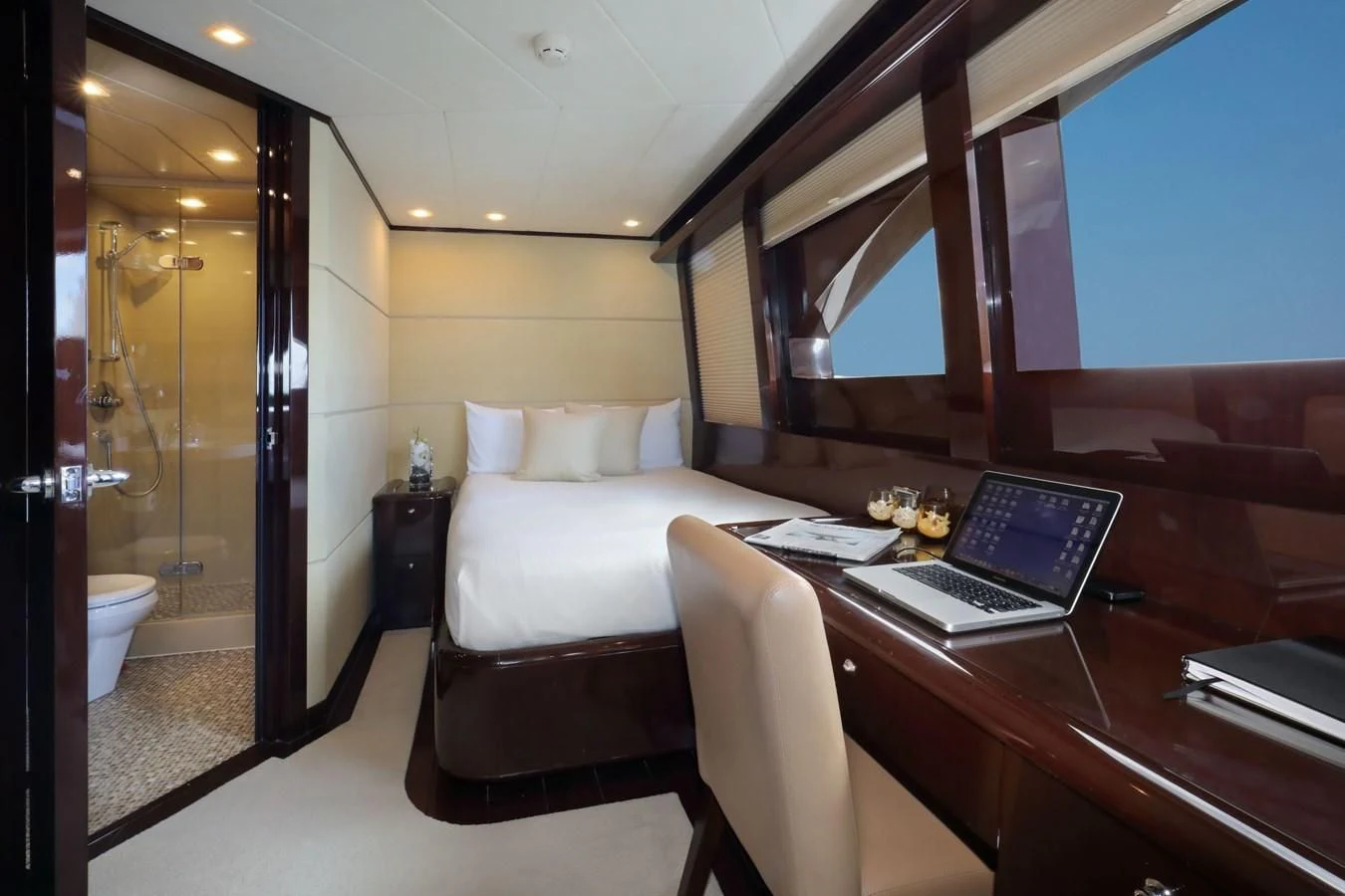 a hotel room with a laptop aboard TRUE NORTH Yacht for Sale