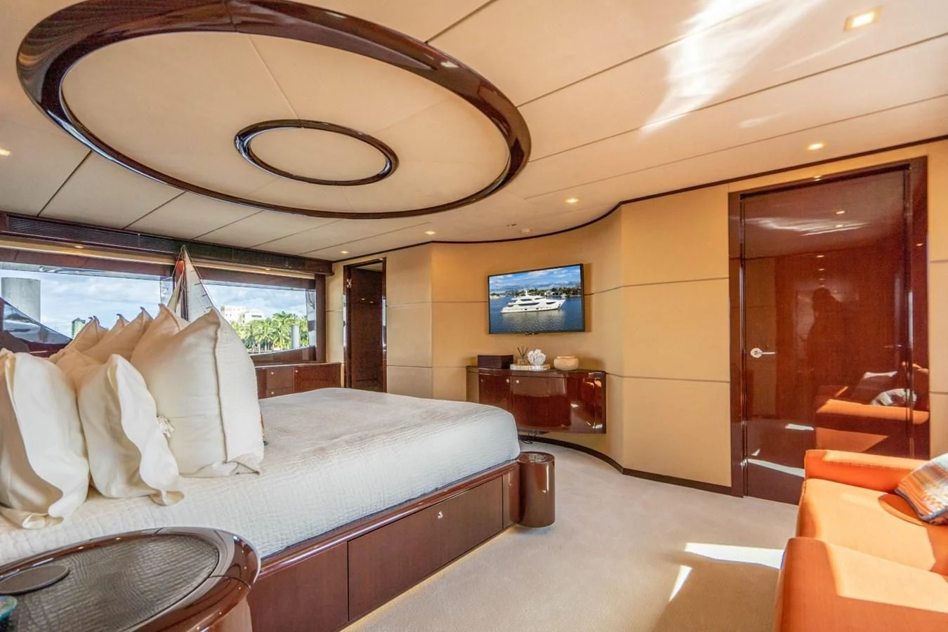 a bedroom with a bed and a large fan aboard TRUE NORTH Yacht for Sale