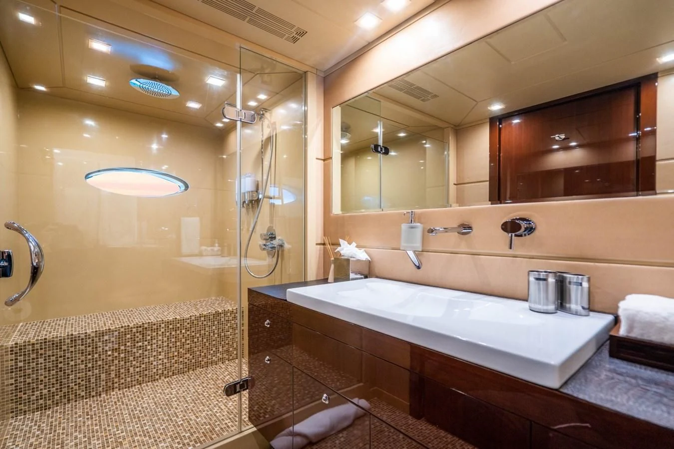a bathroom with a large mirror aboard TRUE NORTH Yacht for Sale