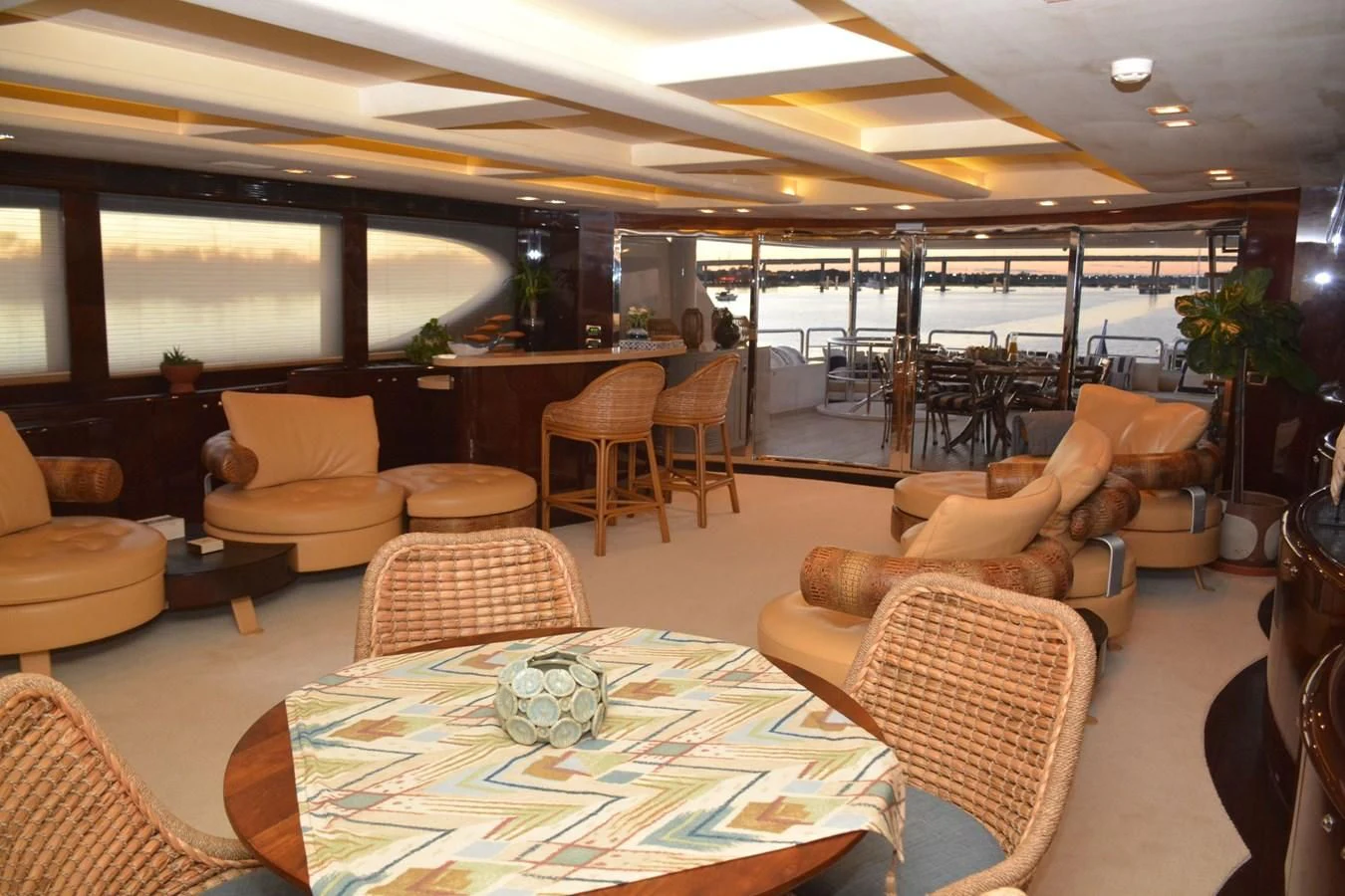 a large living room with a large table and chairs aboard TRUE NORTH Yacht for Sale
