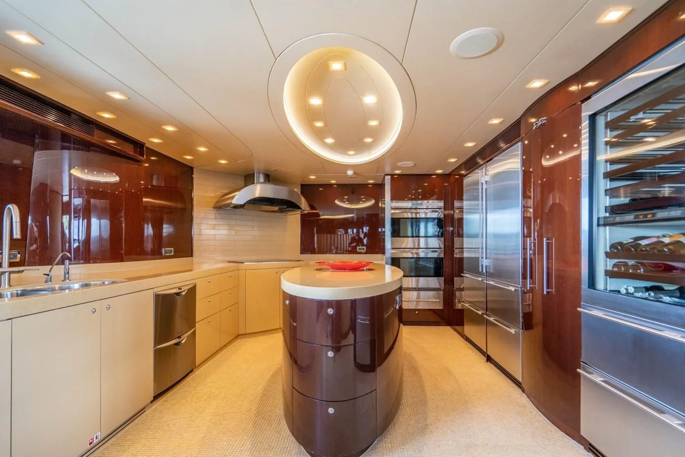 a large kitchen with a round silver sink aboard TRUE NORTH Yacht for Sale