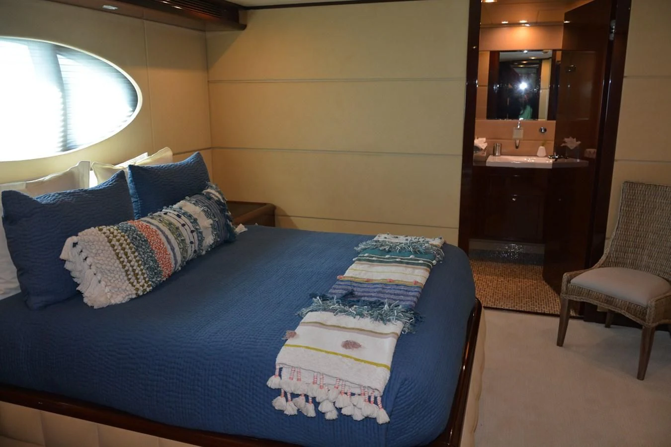 a bed with blue sheets aboard TRUE NORTH Yacht for Sale
