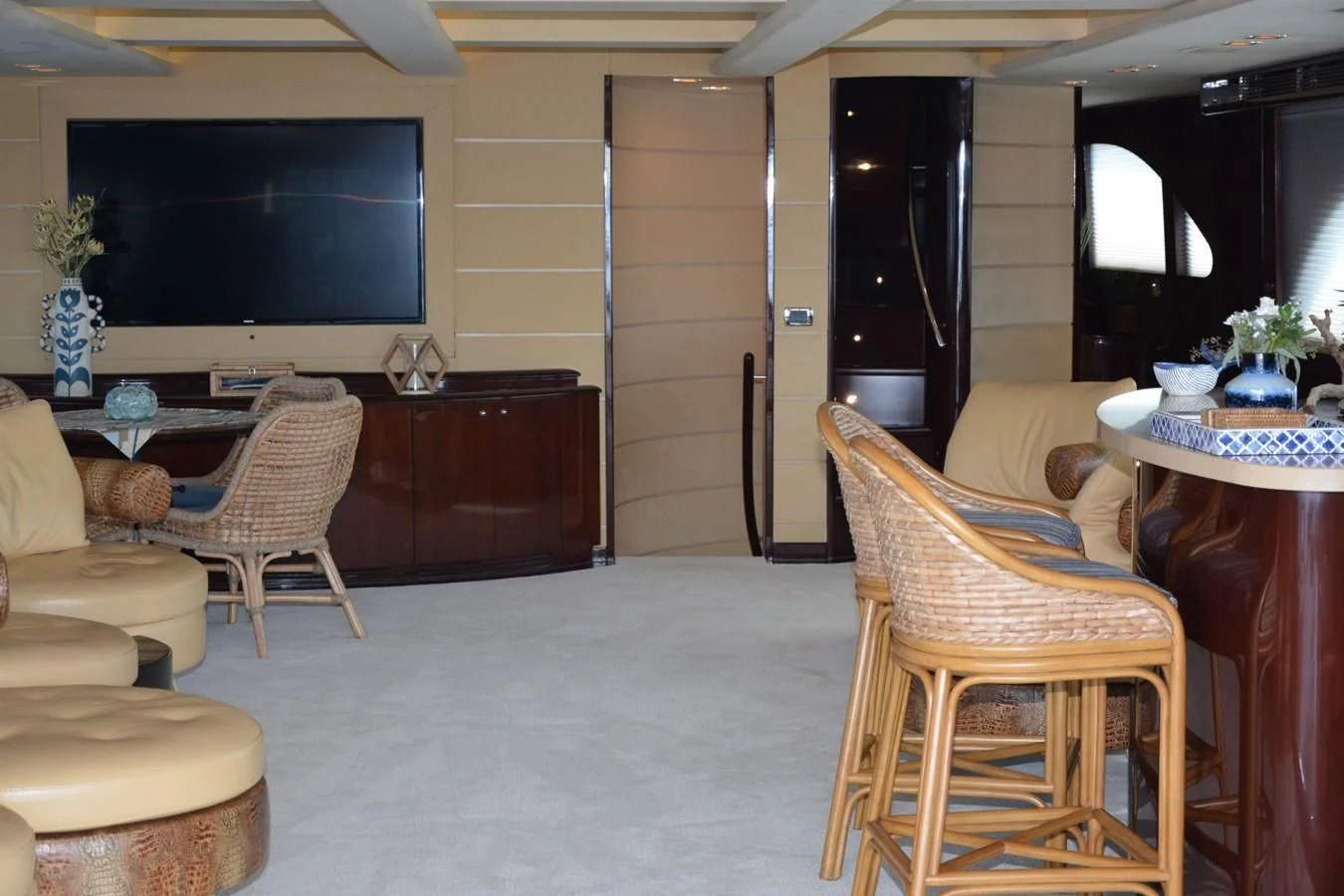 a living room with a tv and furniture aboard TRUE NORTH Yacht for Sale