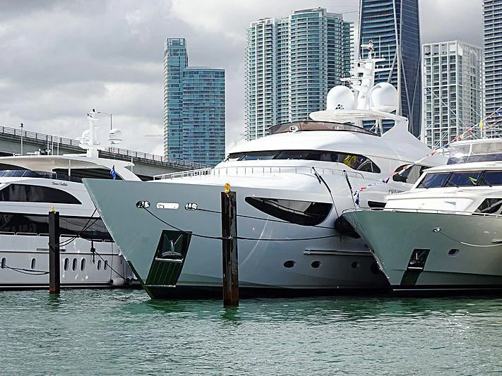 a couple of yachts in the water aboard TRUE NORTH Yacht for Sale