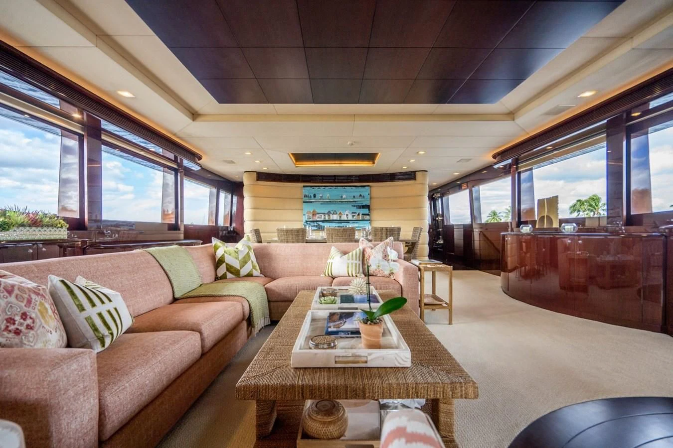 a living room with a table and couches aboard TRUE NORTH Yacht for Sale