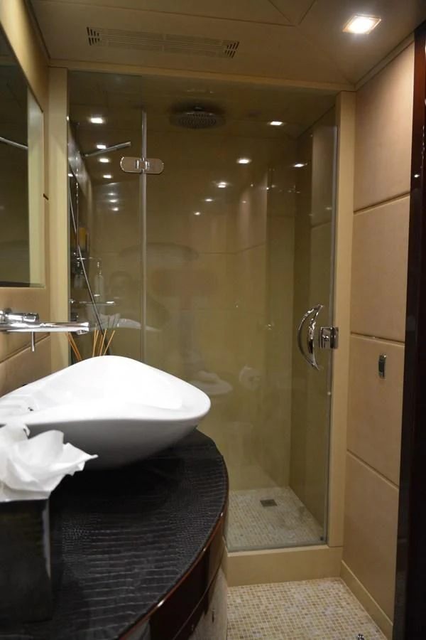 a bathroom with a bathtub and shower aboard TRUE NORTH Yacht for Sale