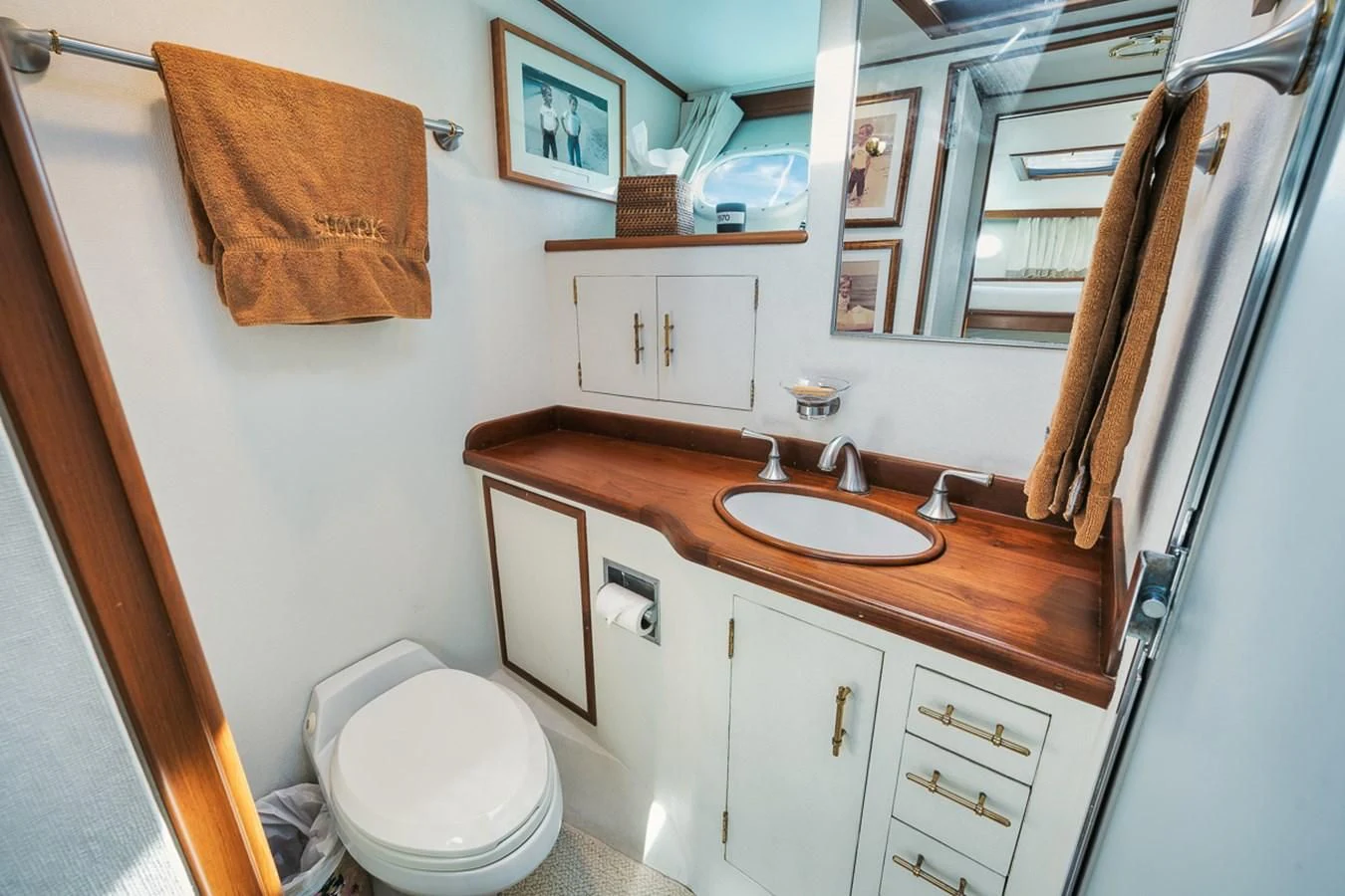 a bathroom with a sink and toilet aboard SHARK Yacht for Sale