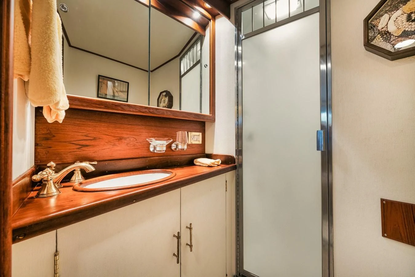 a bathroom with a sink and a mirror aboard SHARK Yacht for Sale