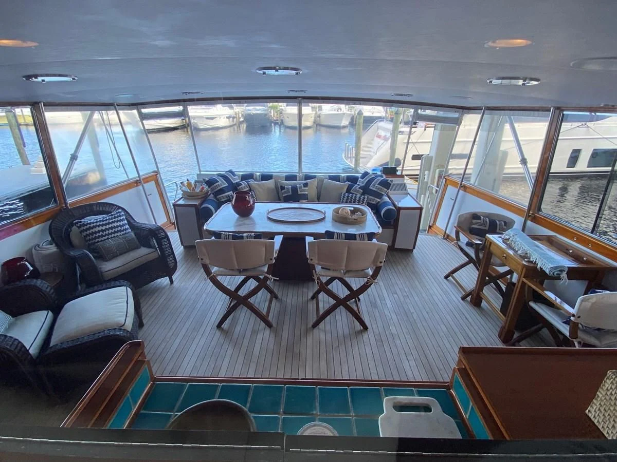 a large dining room with a large table and chairs aboard SHARK Yacht for Sale