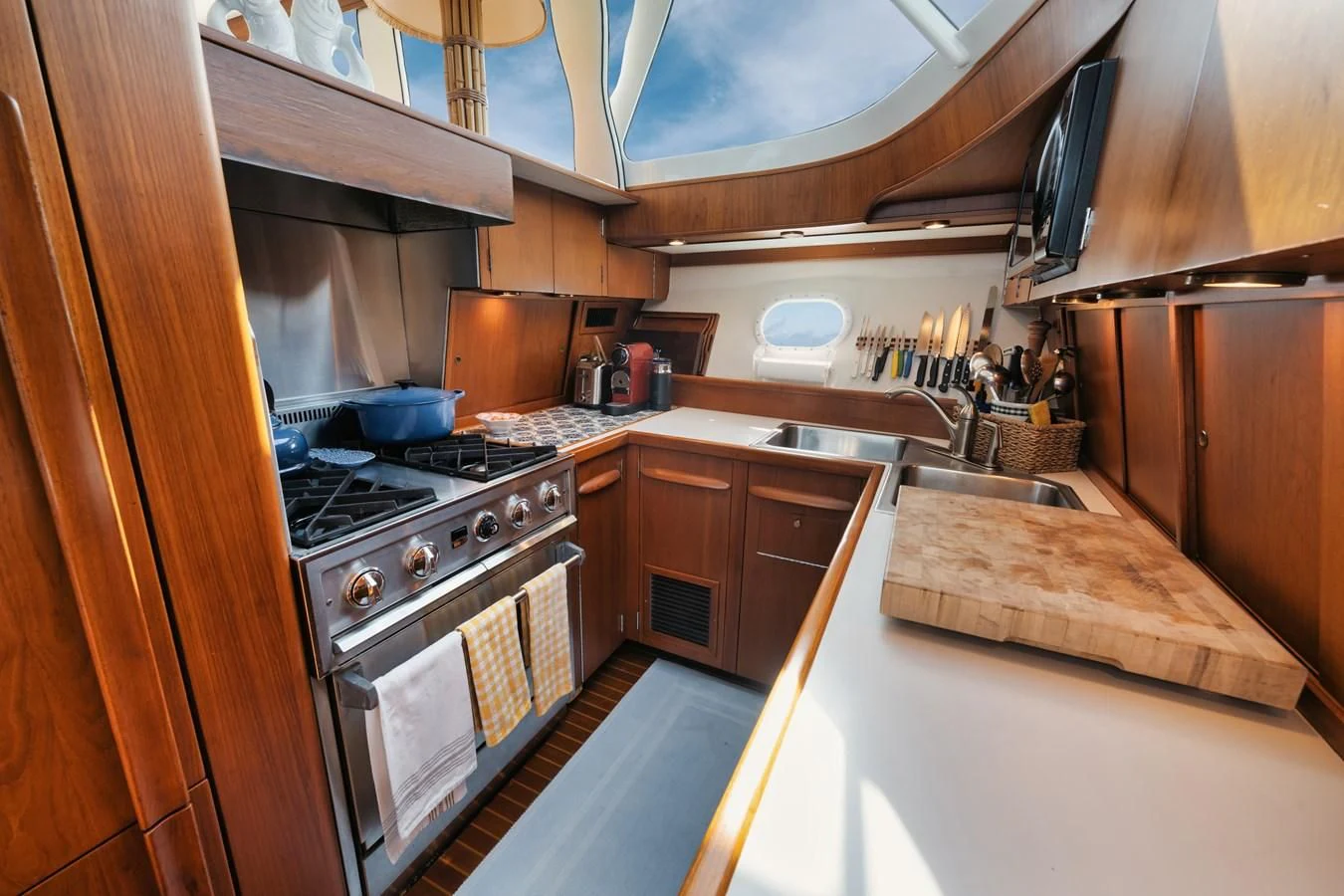 a kitchen with wooden cabinets aboard SHARK Yacht for Sale