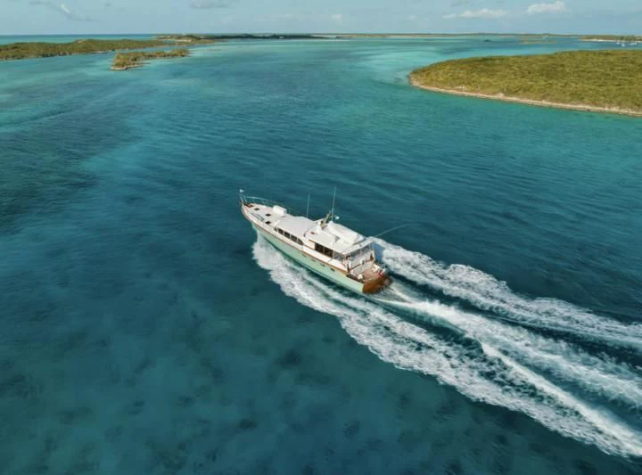 a boat driving on water aboard SHARK Yacht for Sale