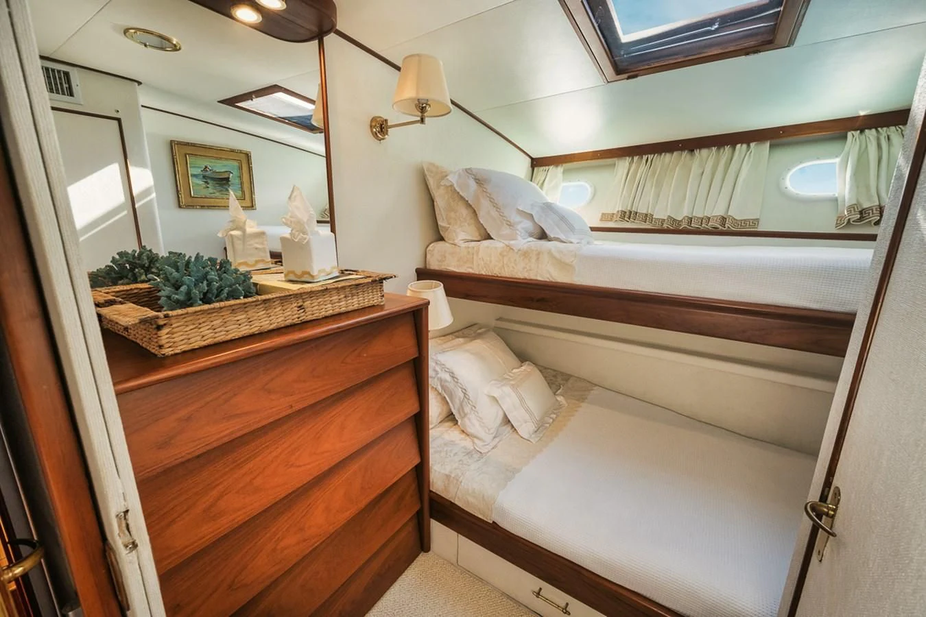 a room with a bed and a dresser aboard SHARK Yacht for Sale