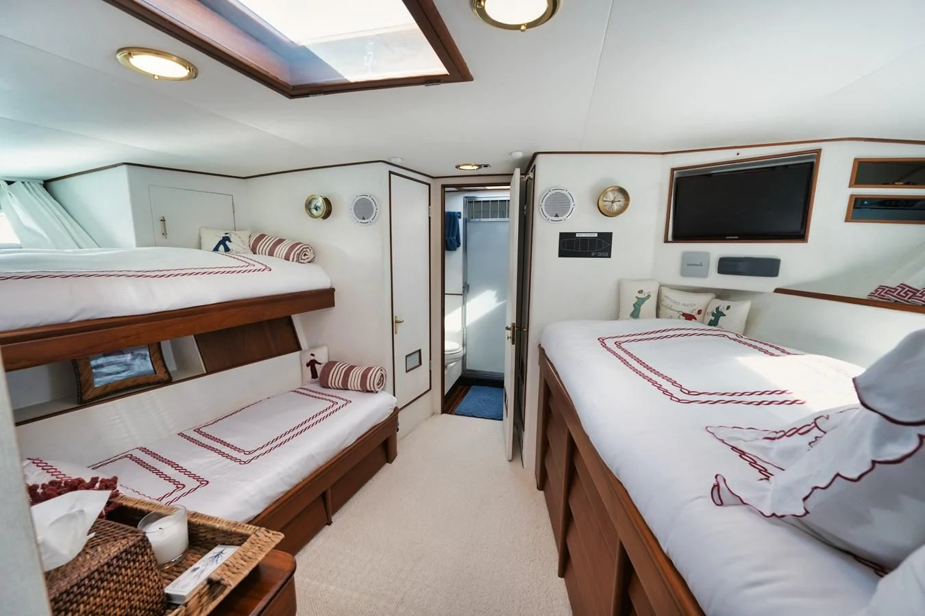 a room with beds and a tv aboard SHARK Yacht for Sale