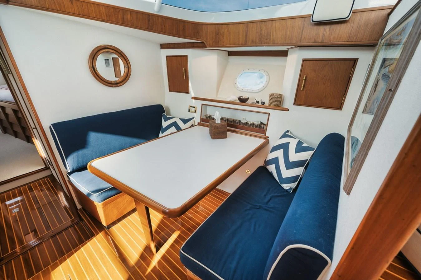 a room with a table and chairs aboard SHARK Yacht for Sale