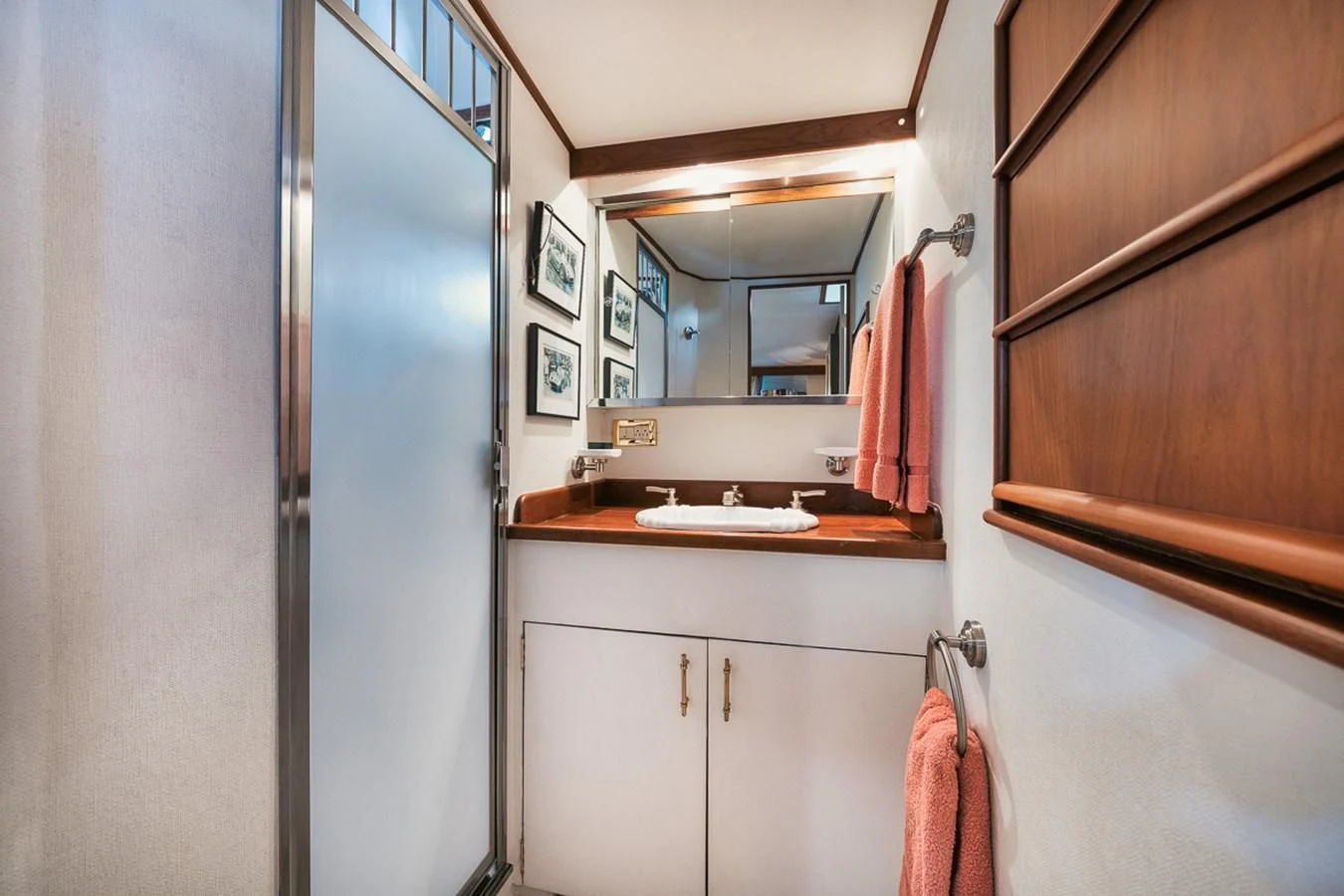 a bathroom with a sink and a mirror aboard SHARK Yacht for Sale