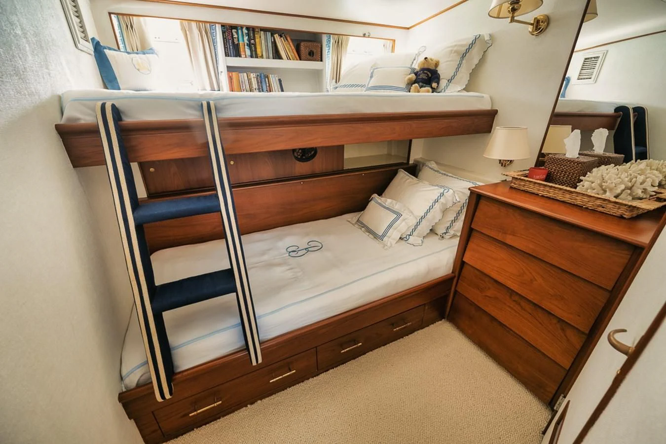 a bunk bed with a wooden frame aboard SHARK Yacht for Sale