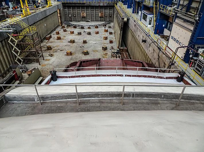 a boat in a large building aboard PROJECT FAITH Yacht for Sale
