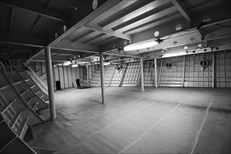 a large warehouse with many racks of equipment aboard PROJECT FAITH Yacht for Sale