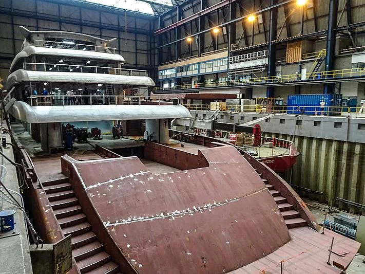 a boat in a harbor aboard PROJECT FAITH Yacht for Sale