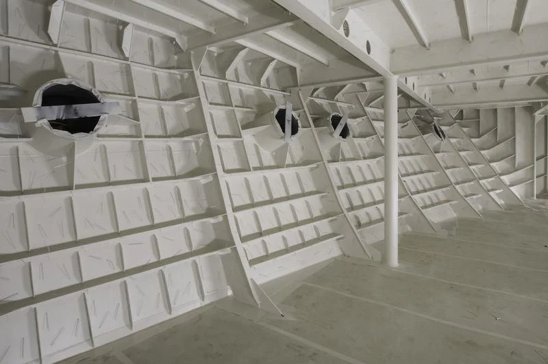 a room with shelves and a person in a mask aboard PROJECT FAITH Yacht for Sale
