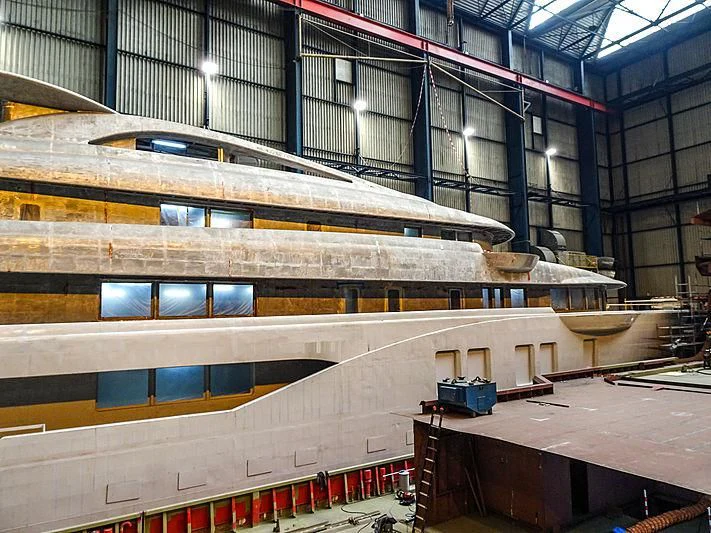 a large warehouse with a large metal structure aboard PROJECT FAITH Yacht for Sale
