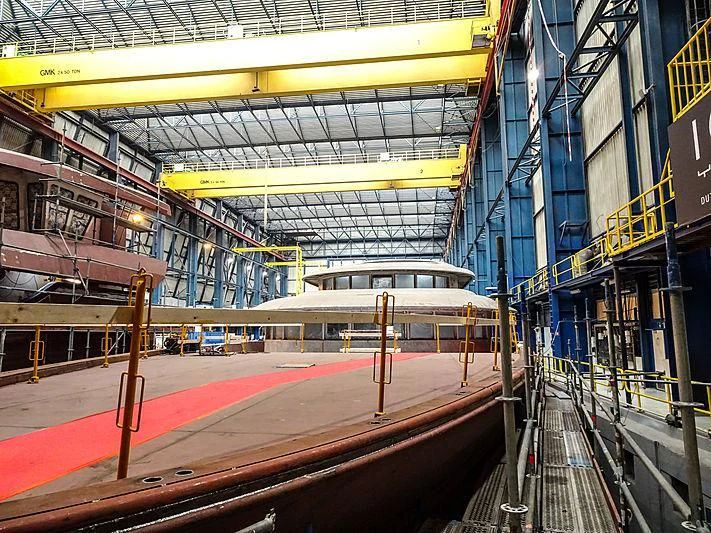 a train station with a red train aboard PROJECT FAITH Yacht for Sale
