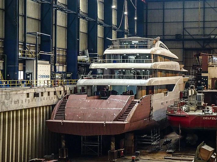 a large cruise ship docked aboard PROJECT FAITH Yacht for Sale
