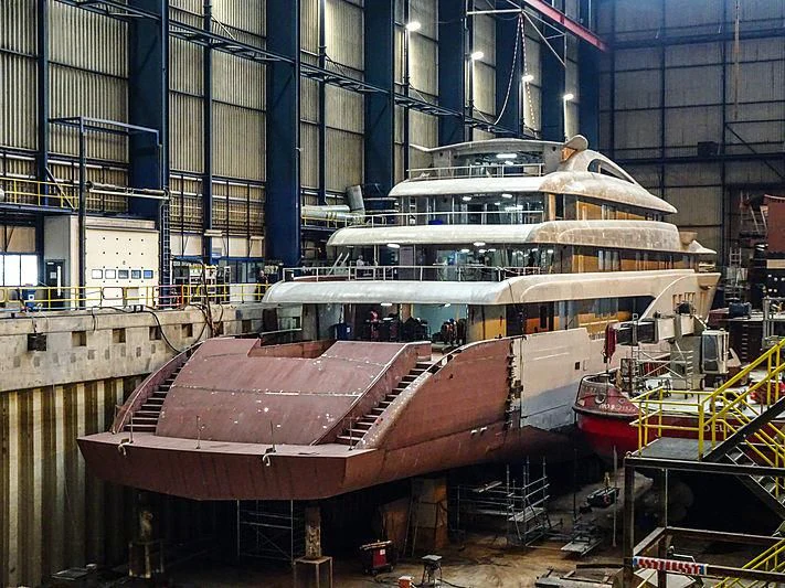 a large cruise ship in a large building aboard PROJECT FAITH Yacht for Sale