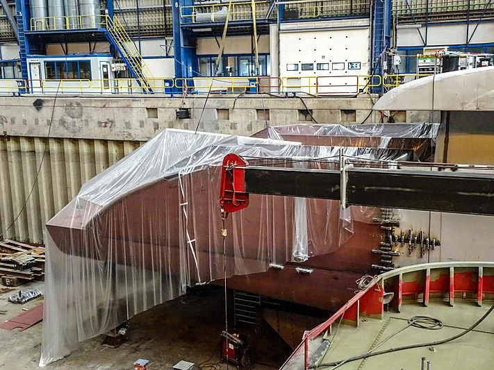 a large metal structure with a red circle on top aboard PROJECT FAITH Yacht for Sale