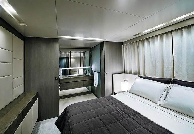 a room with a bed and a window aboard BLUE AGAVE Yacht for Sale