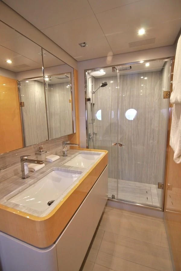 a bathroom with a shower and sink aboard VERSILCRAFT V86 Yacht for Sale