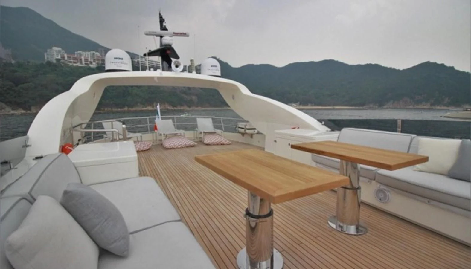 a boat with a table and chairs aboard VERSILCRAFT V86 Yacht for Sale