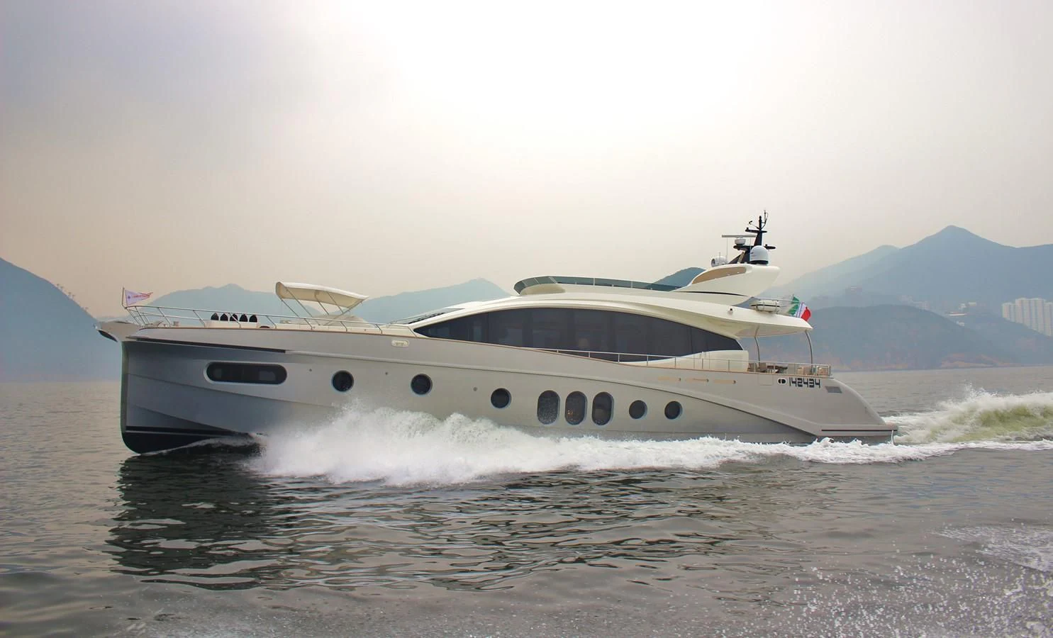 a boat splashing in the water aboard VERSILCRAFT V86 Yacht for Sale