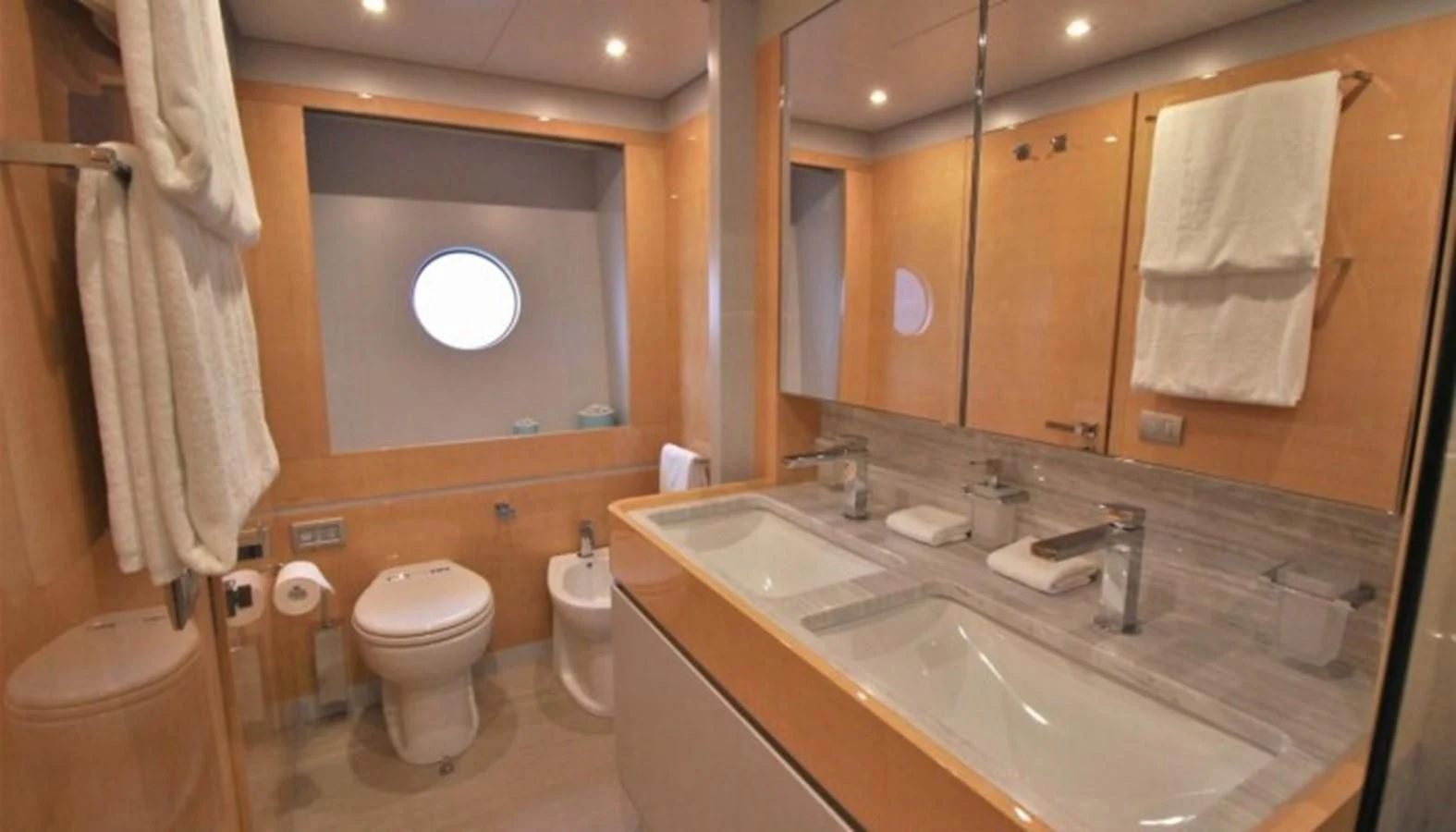 a bathroom with a large mirror aboard VERSILCRAFT V86 Yacht for Sale
