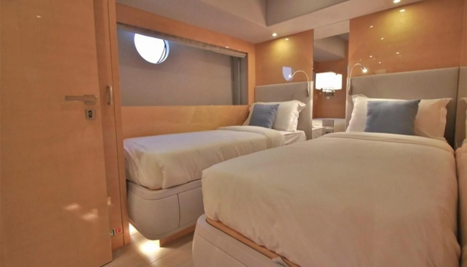 a room with a bed and a door aboard VERSILCRAFT V86 Yacht for Sale