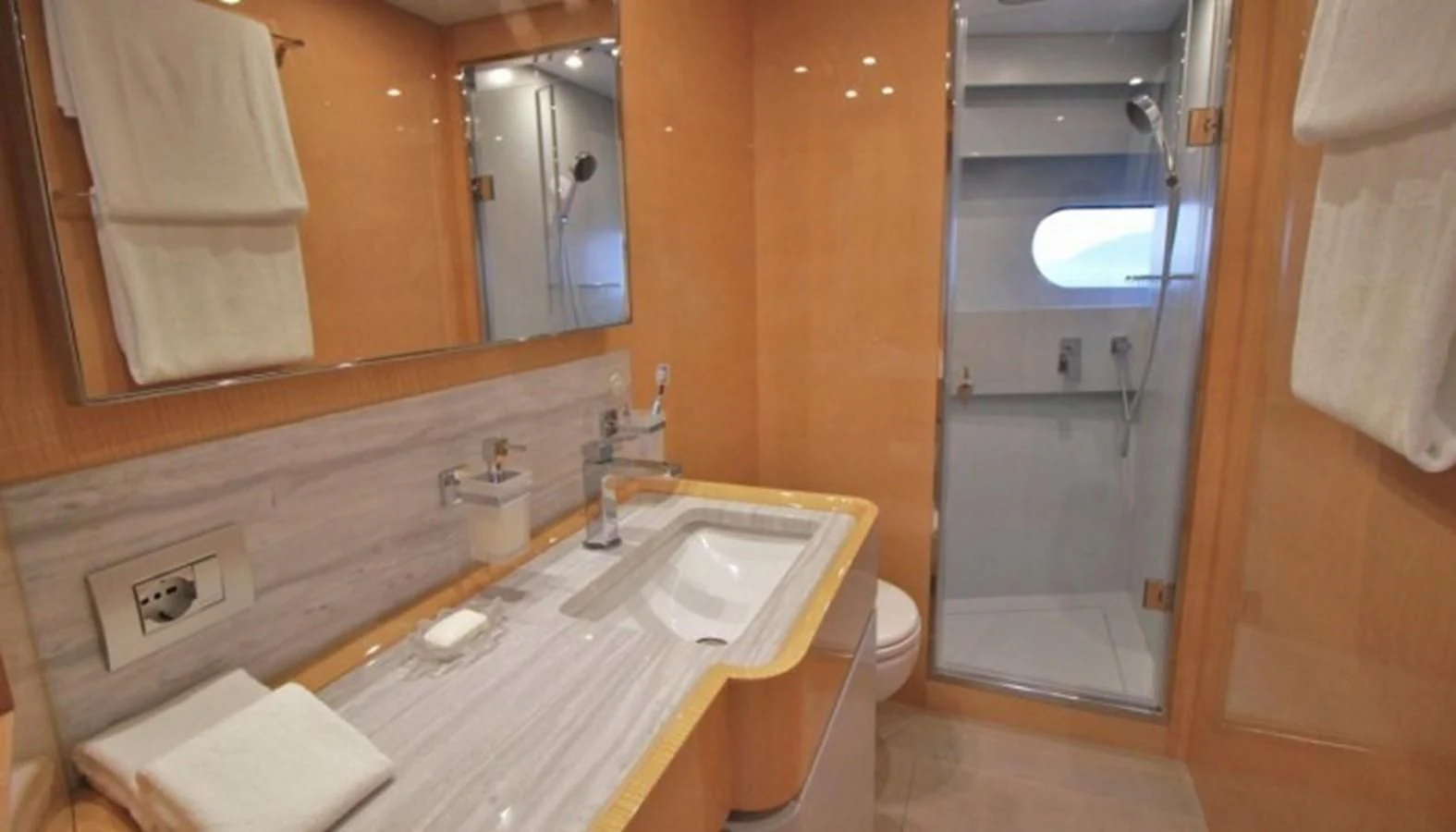 a bathroom with a sink and a shower aboard VERSILCRAFT V86 Yacht for Sale