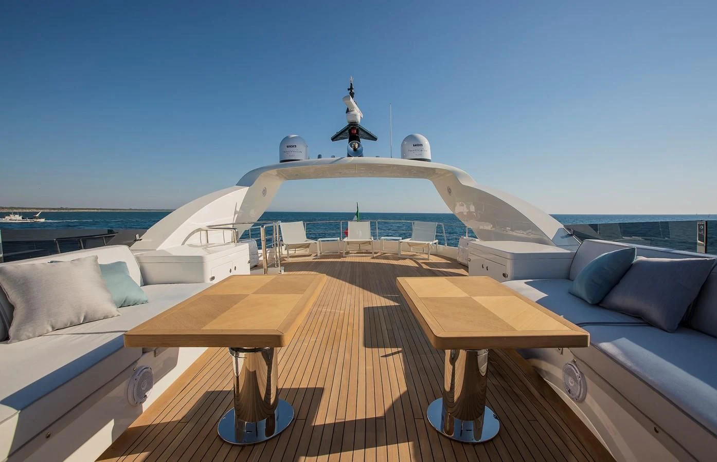 a boat with a table and a bench on it aboard VERSILCRAFT V86 Yacht for Sale