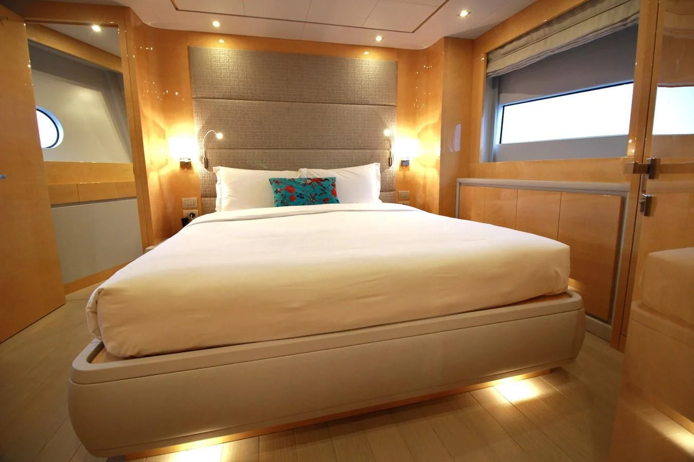 a bed with white sheets aboard VERSILCRAFT V86 Yacht for Sale