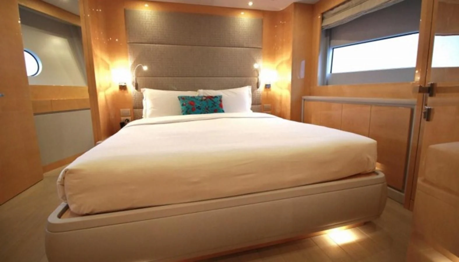 a bed with a white comforter aboard VERSILCRAFT V86 Yacht for Sale