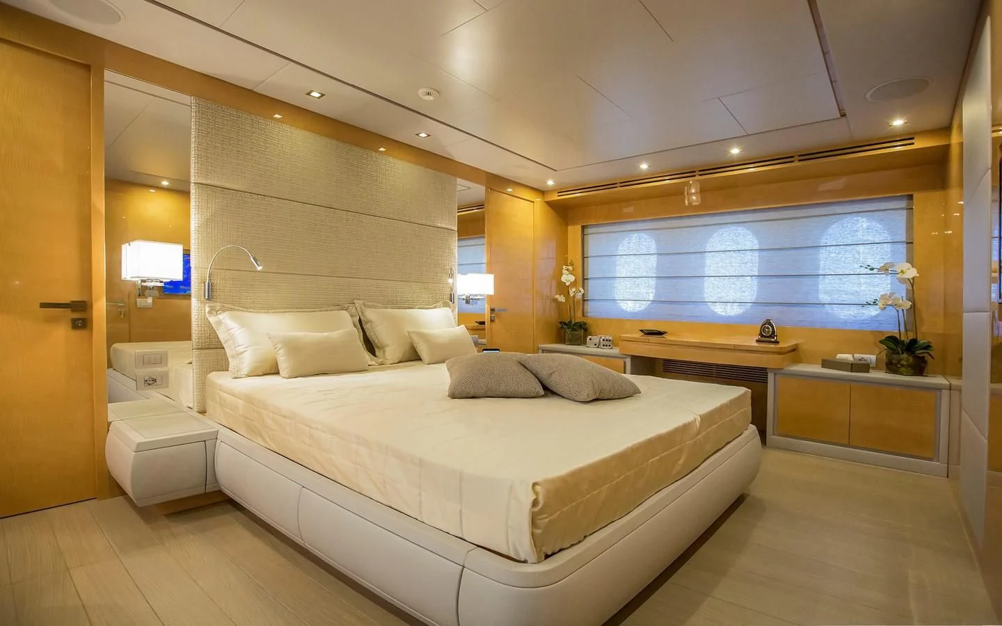 a large bedroom with a large bed aboard VERSILCRAFT V86 Yacht for Sale