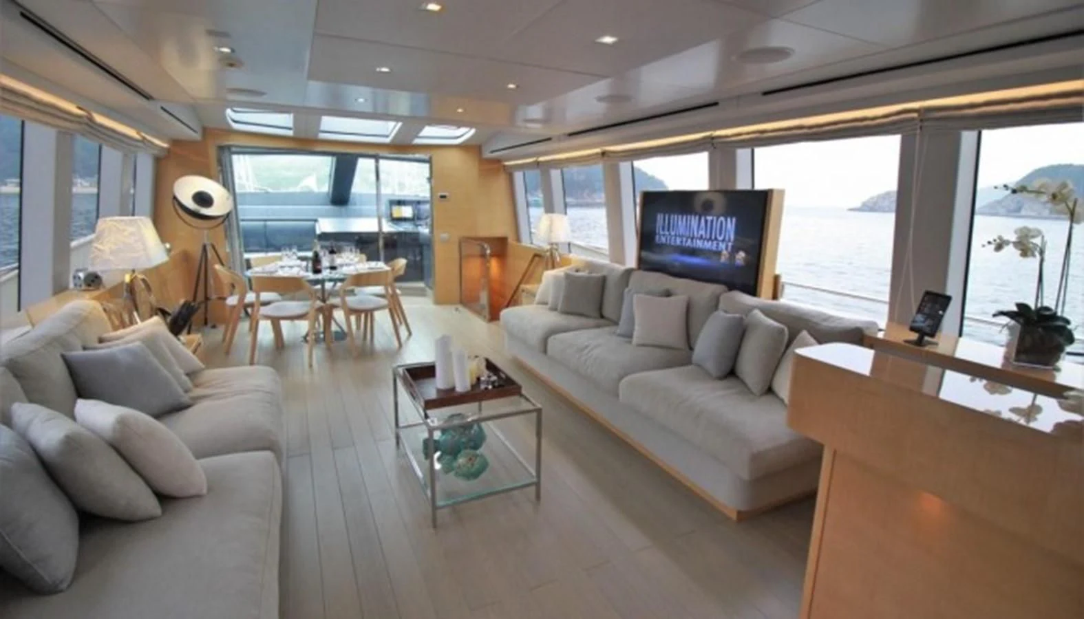 a living room with a large window aboard VERSILCRAFT V86 Yacht for Sale