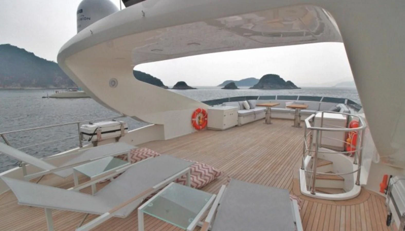 a deck with a boat on it aboard VERSILCRAFT V86 Yacht for Sale