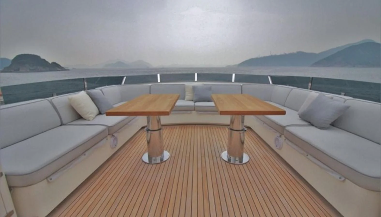 a room with a bed and a table aboard VERSILCRAFT V86 Yacht for Sale