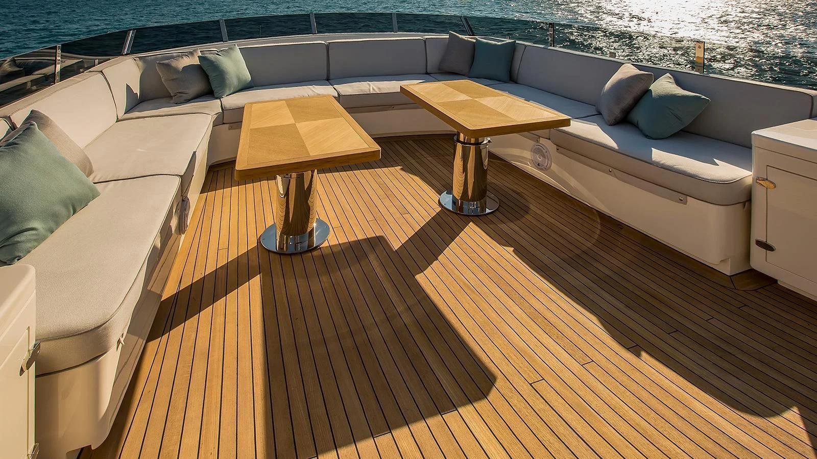 a deck with a couch and a table on it aboard VERSILCRAFT V86 Yacht for Sale