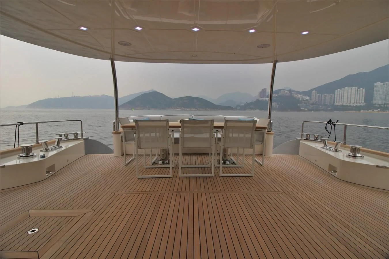 a room with a table and chairs aboard VERSILCRAFT V86 Yacht for Sale