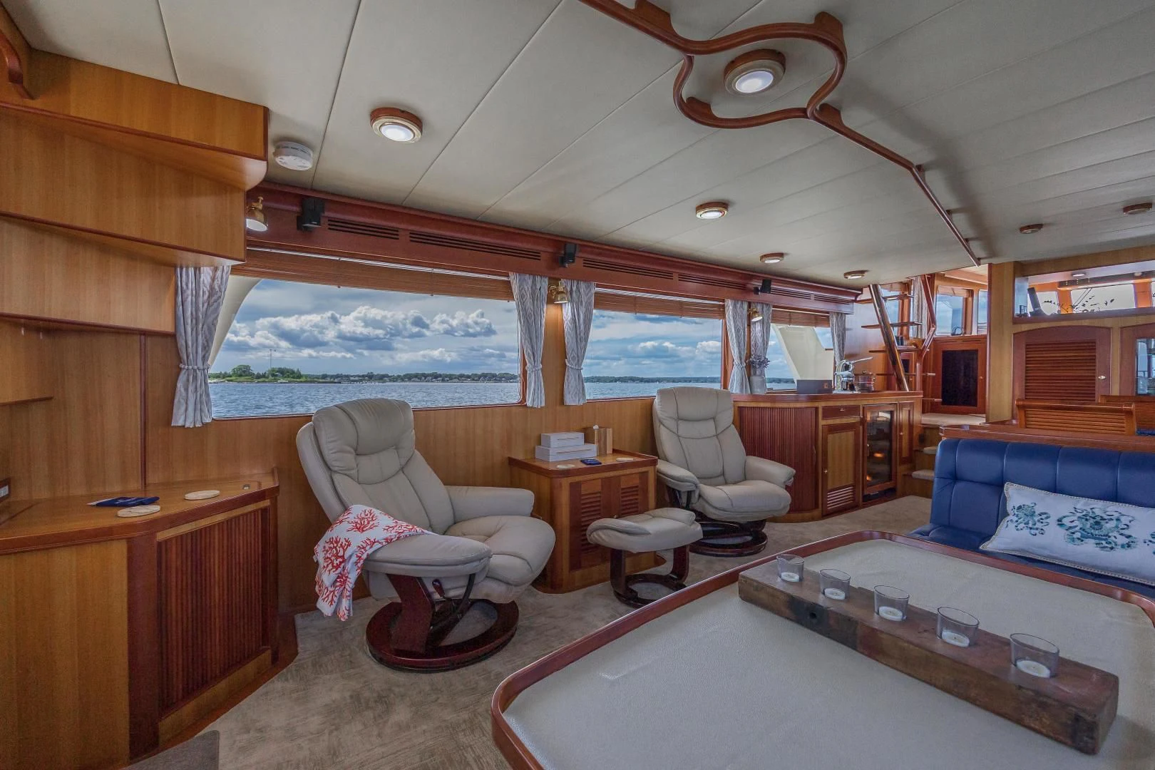 a room with a bed and a couch aboard DISCONNECTED Yacht for Sale