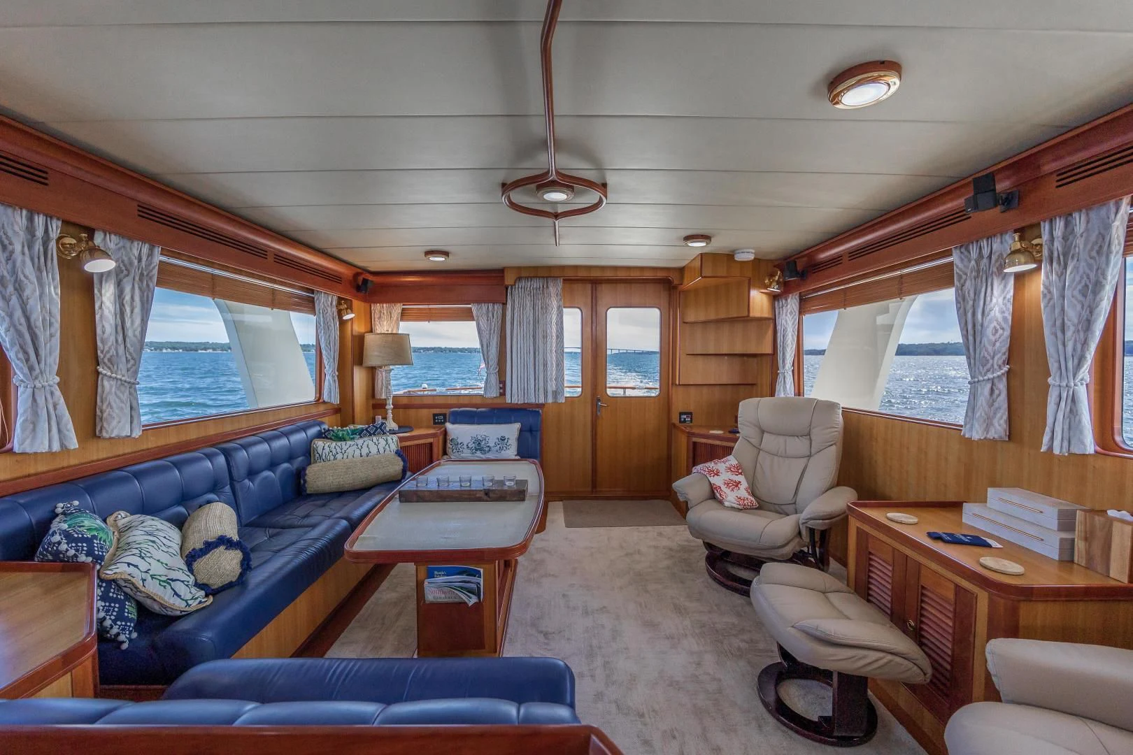 a living room with a couch and a table aboard DISCONNECTED Yacht for Sale