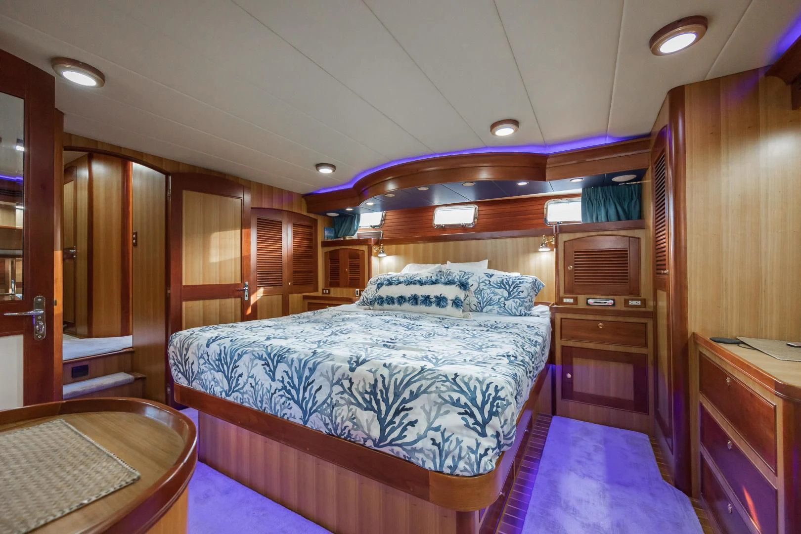 a bedroom with a bed and a desk aboard DISCONNECTED Yacht for Sale